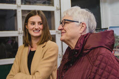 Two smiling women in conversation